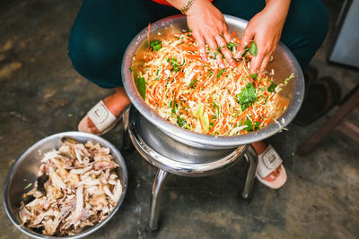 Low section of woman preparing food at home