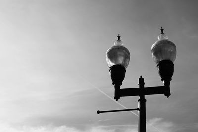 Low angle view of street light against sky