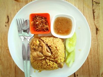 High angle view of serving food in plate on table