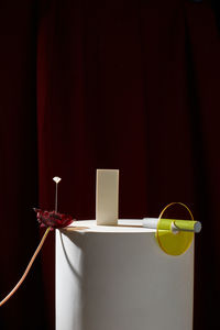 Close-up of box on table against wall