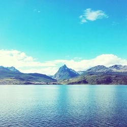 Scenic view of mountains against blue sky