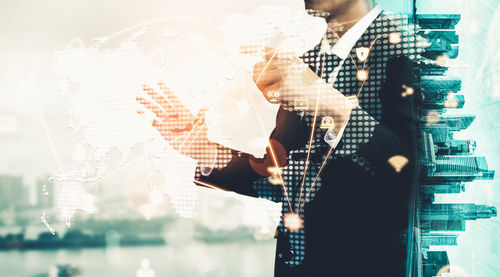 Digital composite image of man working in city