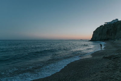 Scenic view of sea against clear sky during sunset