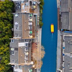 High angle view of canal amidst houses