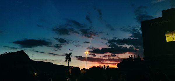 Low angle view of silhouette buildings against sky during sunset