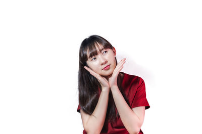 Portrait of a beautiful young woman over white background