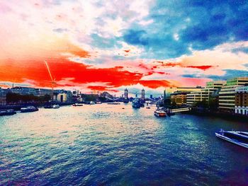 Scenic view of wet city against sky during sunset