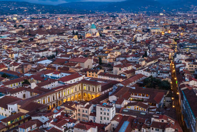 High angle view of illuminated buildings in city