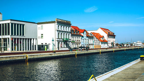 View of buildings against blue sky