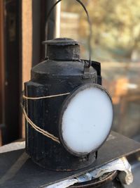 Close-up of old electric lamp on table