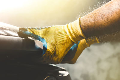 Close-up of man holding umbrella