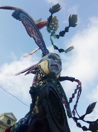 Low angle view of statue against sky