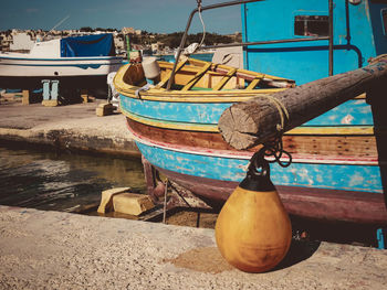 Fishing boats moored at harbor