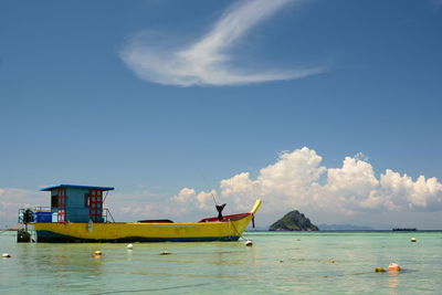 Fishing boat moored in laemtong beach. koh phi phi. krabi province. thailand