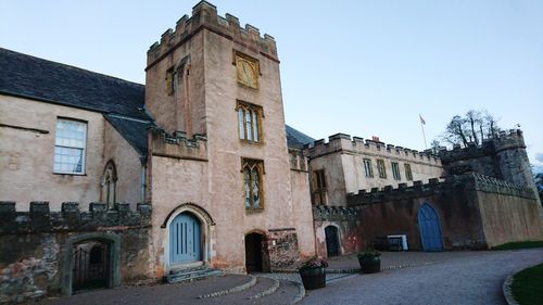 Low angle view of old building against sky