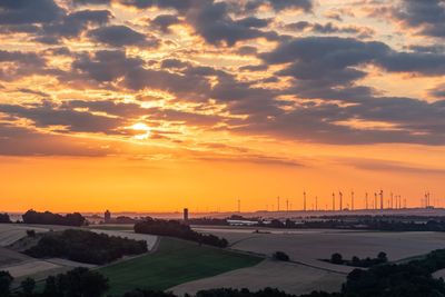 Scenic view of landscape against sky during sunset