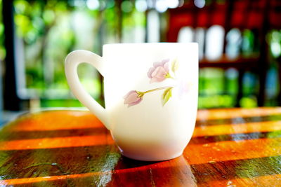 Close-up of coffee cup on table