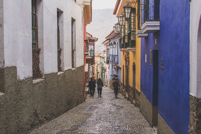 People in front of buildings