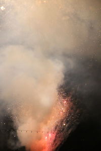 Fireworks exploding at night