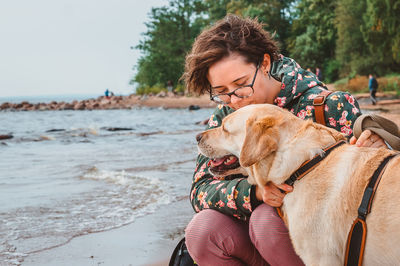 Woman with dog on beach