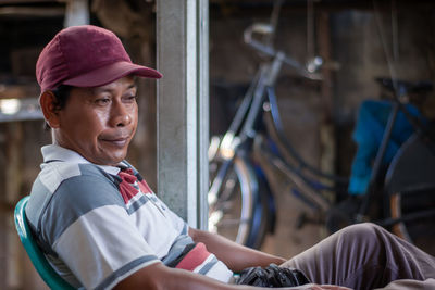 Portrait of smiling man wearing hat