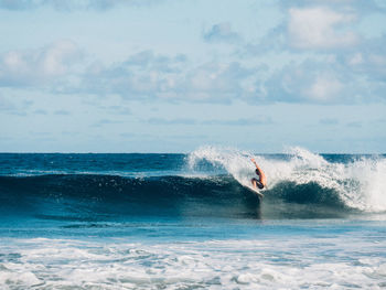 People surfing in sea