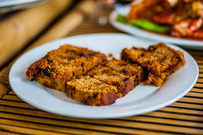 Close-up of fruitcake served on table