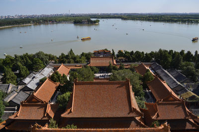 High angle view of townscape by building against sky