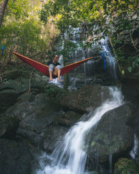 Scenic view of waterfall in forest