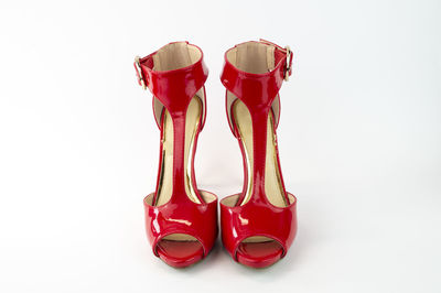 Close-up of red shoes against white background