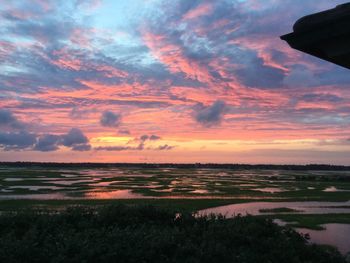 Scenic view of sea against cloudy sky