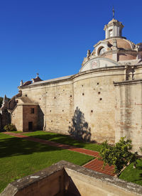 Low angle view of building against clear blue sky