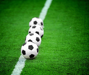 Soccer balls on field