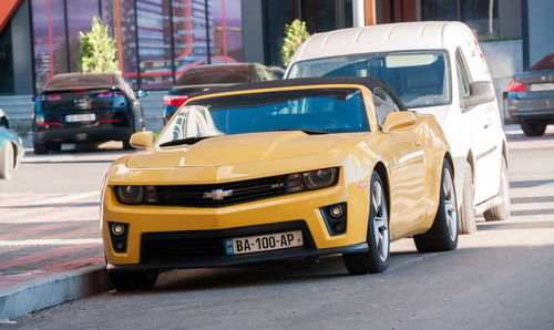 Yellow car on city street