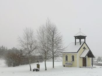 Traditional building against sky during winter