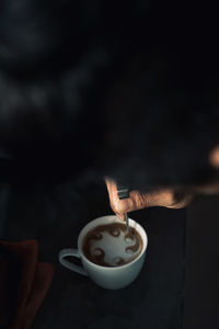 Person holding coffee cup