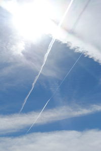 Low angle view of vapor trails in sky