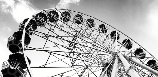 Low angle view of ferris wheel against sky