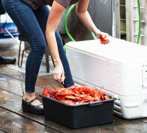 Low section of people preparing food