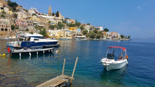 Boats moored at harbor