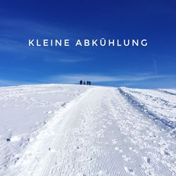 Text on snow covered land against blue sky
