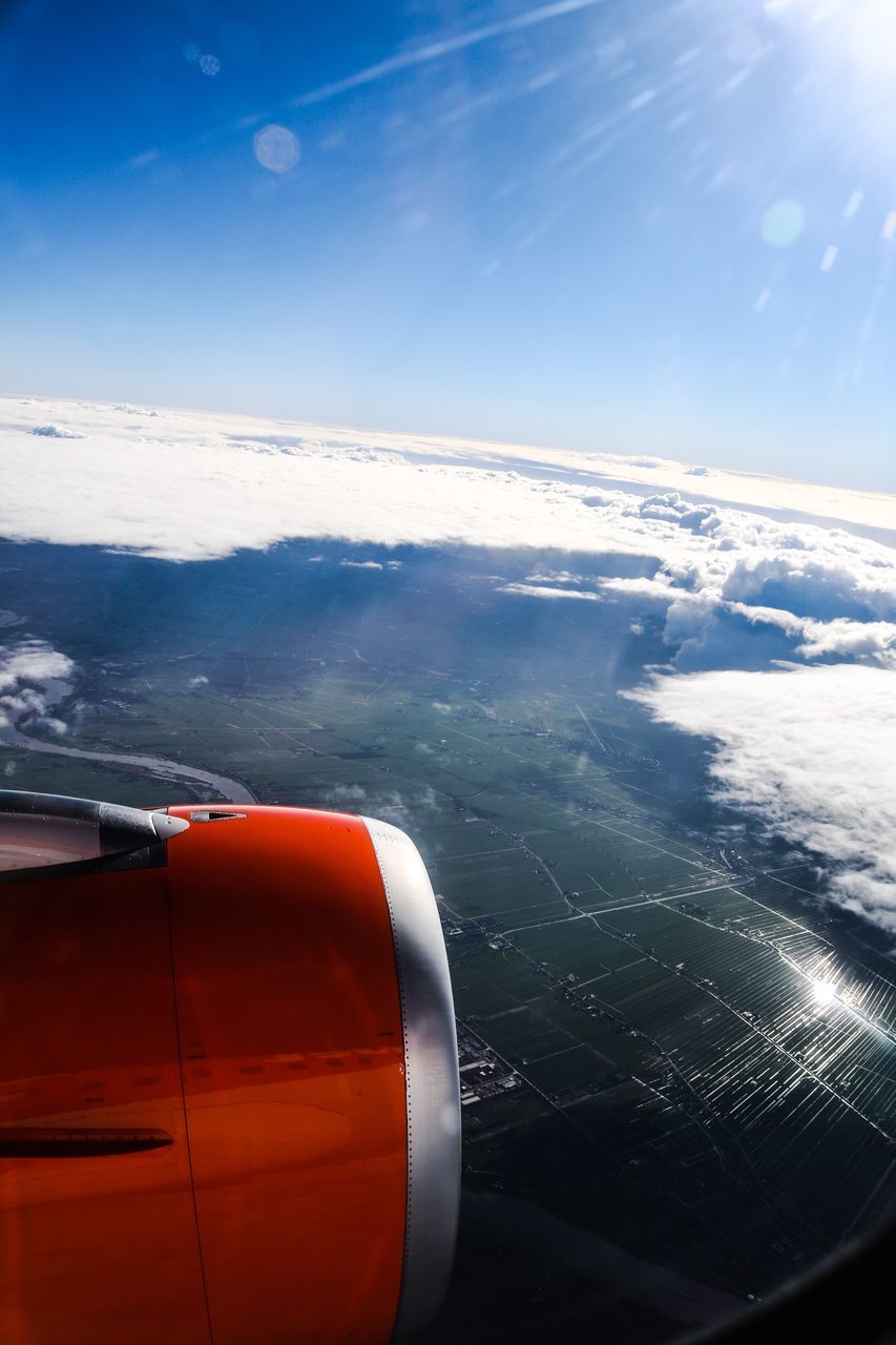 AIRPLANE WING AGAINST SKY