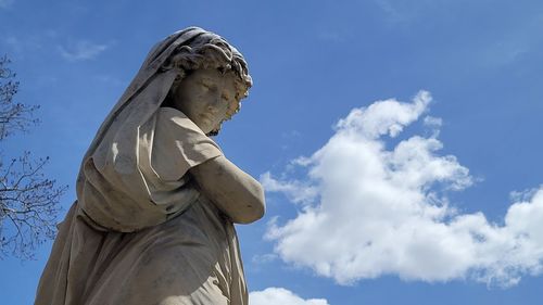 Low angle view of statue against sky