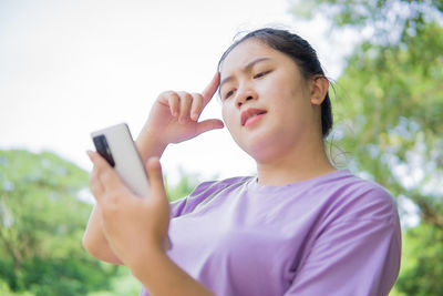 Young woman using mobile phone