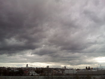 View of city against cloudy sky