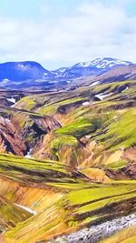 Scenic view of mountain against cloudy sky