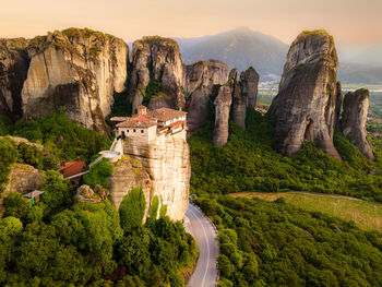 Majestic meteora, sunrise over famous flying monastery. explore unesco's treasures