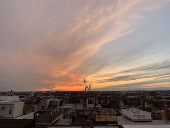 High angle view of buildings against sky during sunset