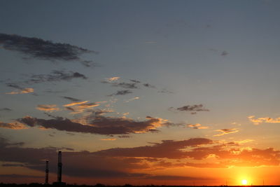 Low angle view of dramatic sky during sunset