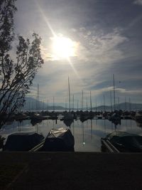 Boat in sea at sunset